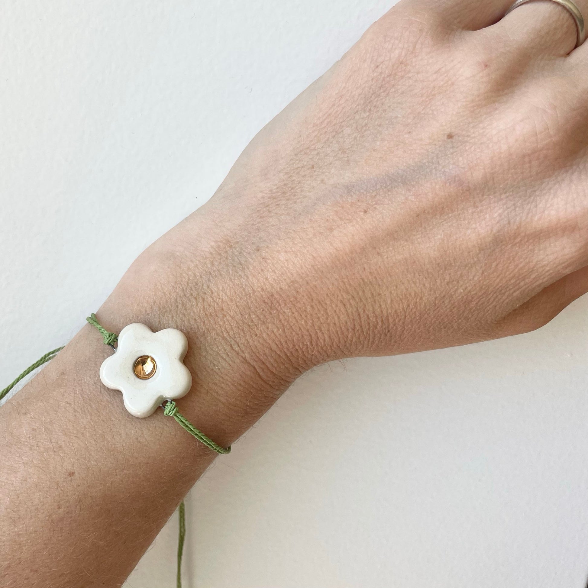 Daisy Bracelet spring green on wrist 2.jpg